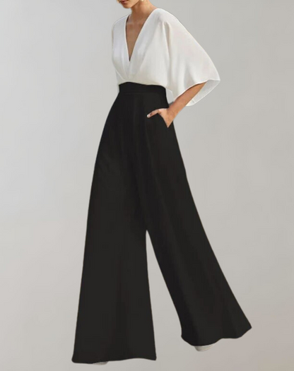 Suzette Jumpsuit Dam – Elegant Jumpsuit med Djup V-ringning & Vida Ben för en Raffinerad Look