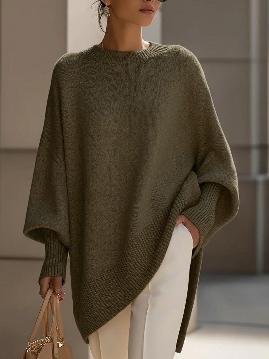 Rosa oversized poncho med avslappnad silhuett och asymmetrisk nederkant