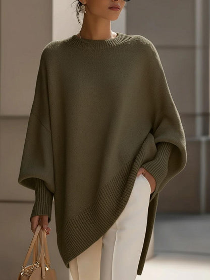 Rosa oversized poncho med avslappnad silhuett och asymmetrisk nederkant