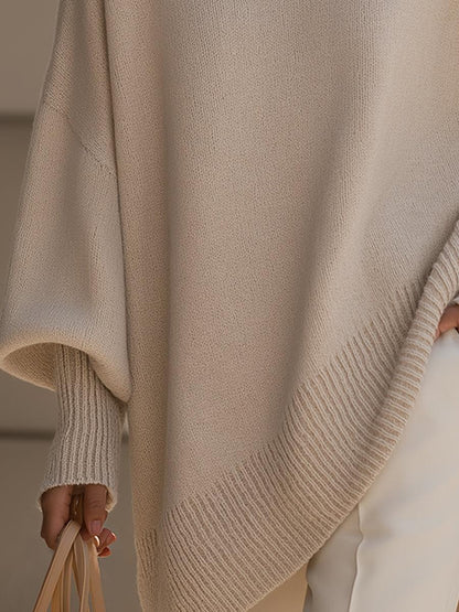 Mira dam poncho stylas med jeans och byxor för en modern layered look